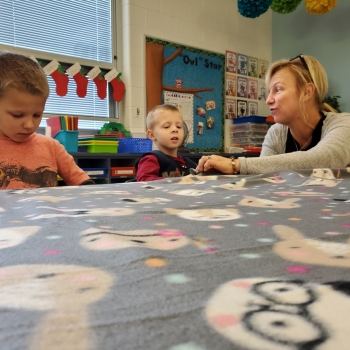 Students making blankets for My Very Own Blanket Organization.